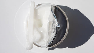 Top view of open Water Balm jar with Spatula 
