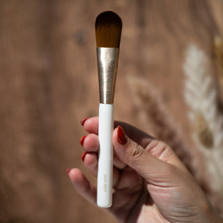 Skin Prep skincare brush with soft bristles held in hand
