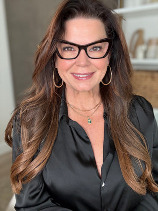 Close-up image of Sonia Roselli smiling, showcasing radiant, healthy, hydrated skin and silky hair