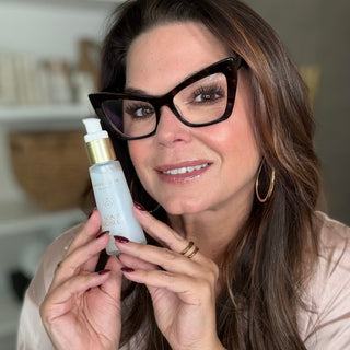 Sonia holding a bottle of Water Elixir