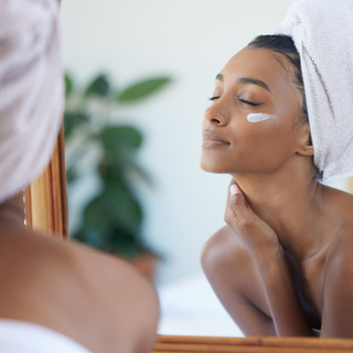 A lady indulging in self-care with a soothing skincare regimen