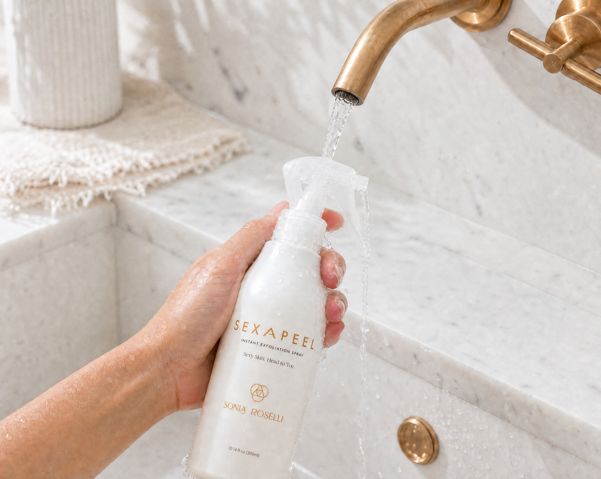 Two skincare products from Sexapeel by Sonia Roselli on a white background with black shadows: a larger off-white spray bottle labeled Instant Exfoliation Spray and a matching off-white tube labeled Commage Peeling Gel.