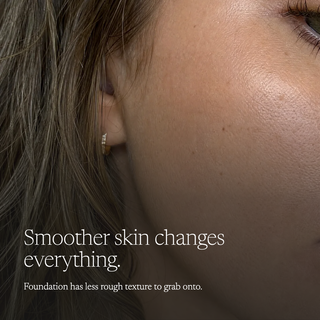 Close-up of a woman's ear and cheek wearing a small gold hoop earring, with overlaid text reading 'Smoother skin changes everything. Foundation has less rough texture to grab onto.