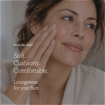 A close-up lifestyle shot of a woman with her hand on her cheek, wearing a beige knit cardigan. White text overlays read: 'And the feel? Soft.