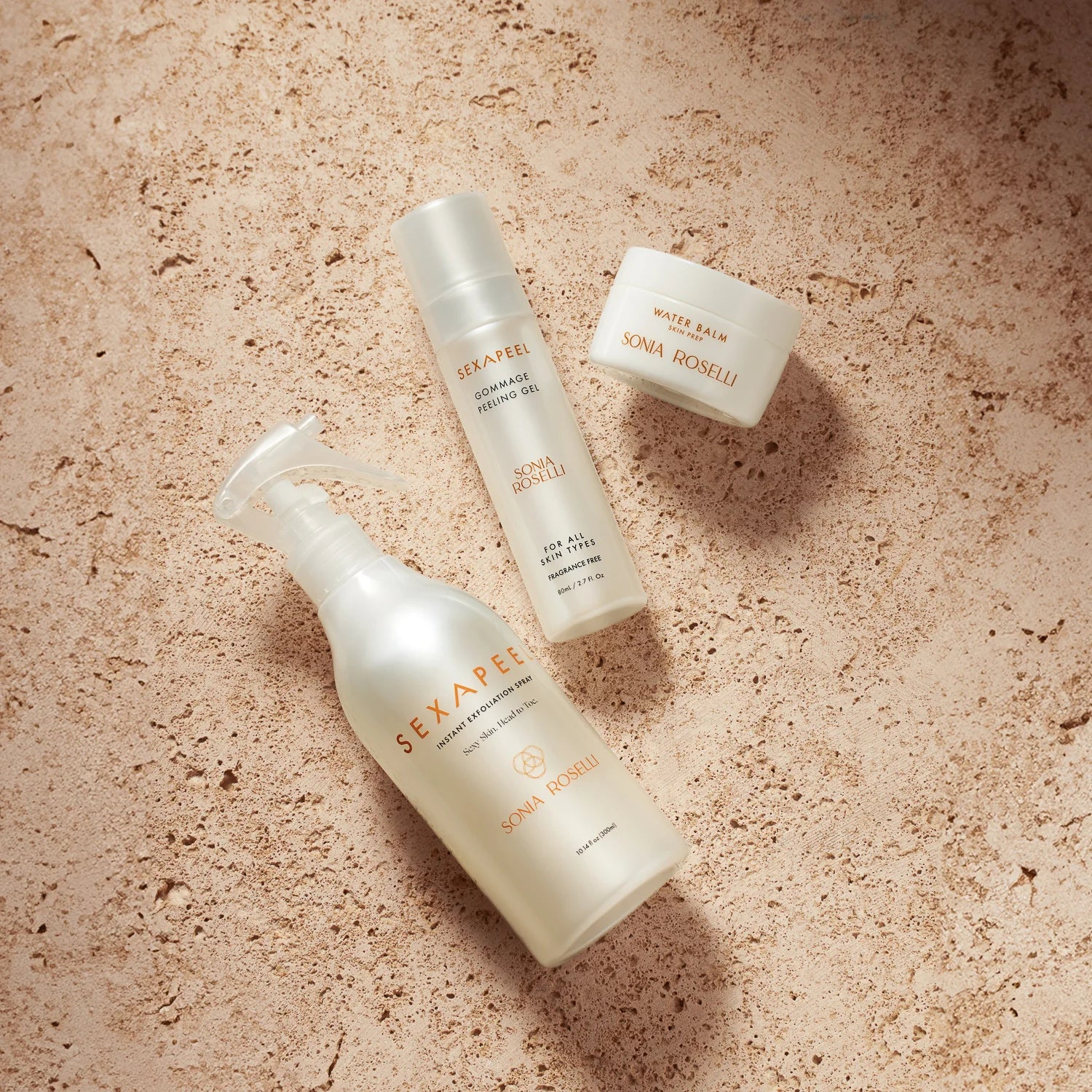Sonia Roselli Exfoliation Essentials on a concrete background for smooth, hydrated, bouncy skin.