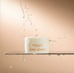 Sonia Roselli Water Balm Skin Prep jar with water splashes, symbolizing deep hydration and moisture barrier protection.