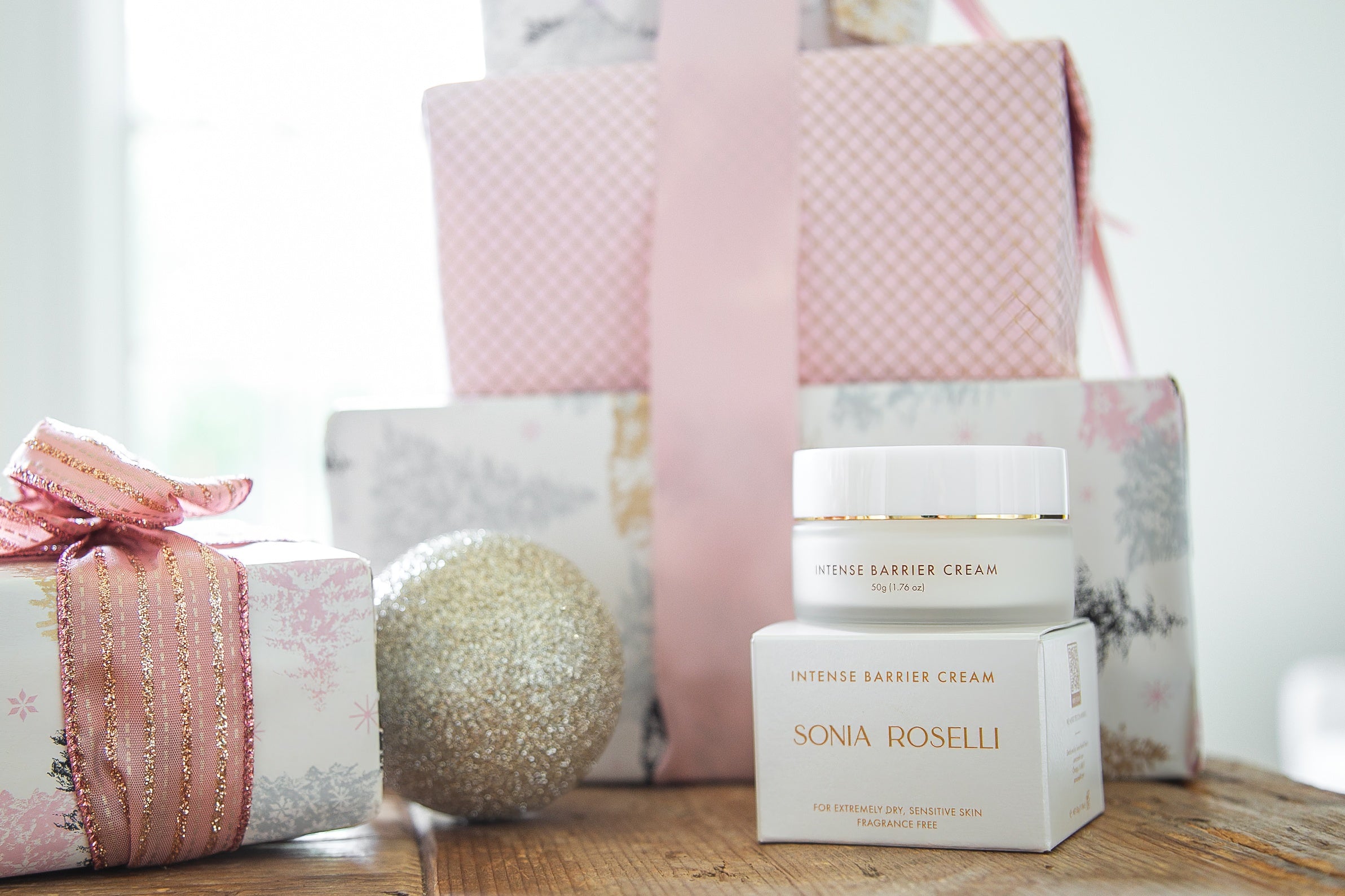 Intense Barrier Cream with holiday gift background 