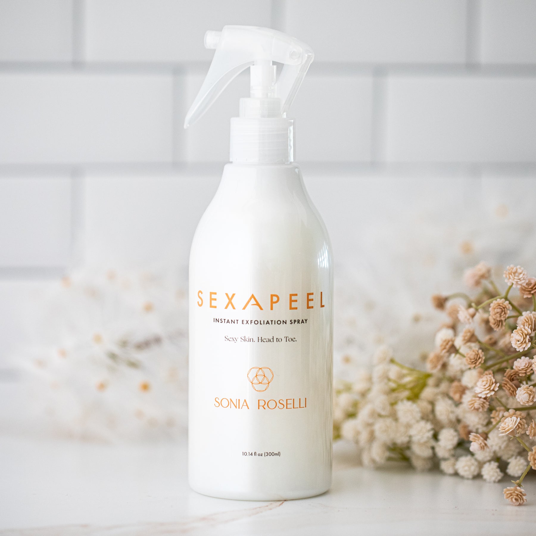 Sexapeel Exfoliation Spray with floral background 