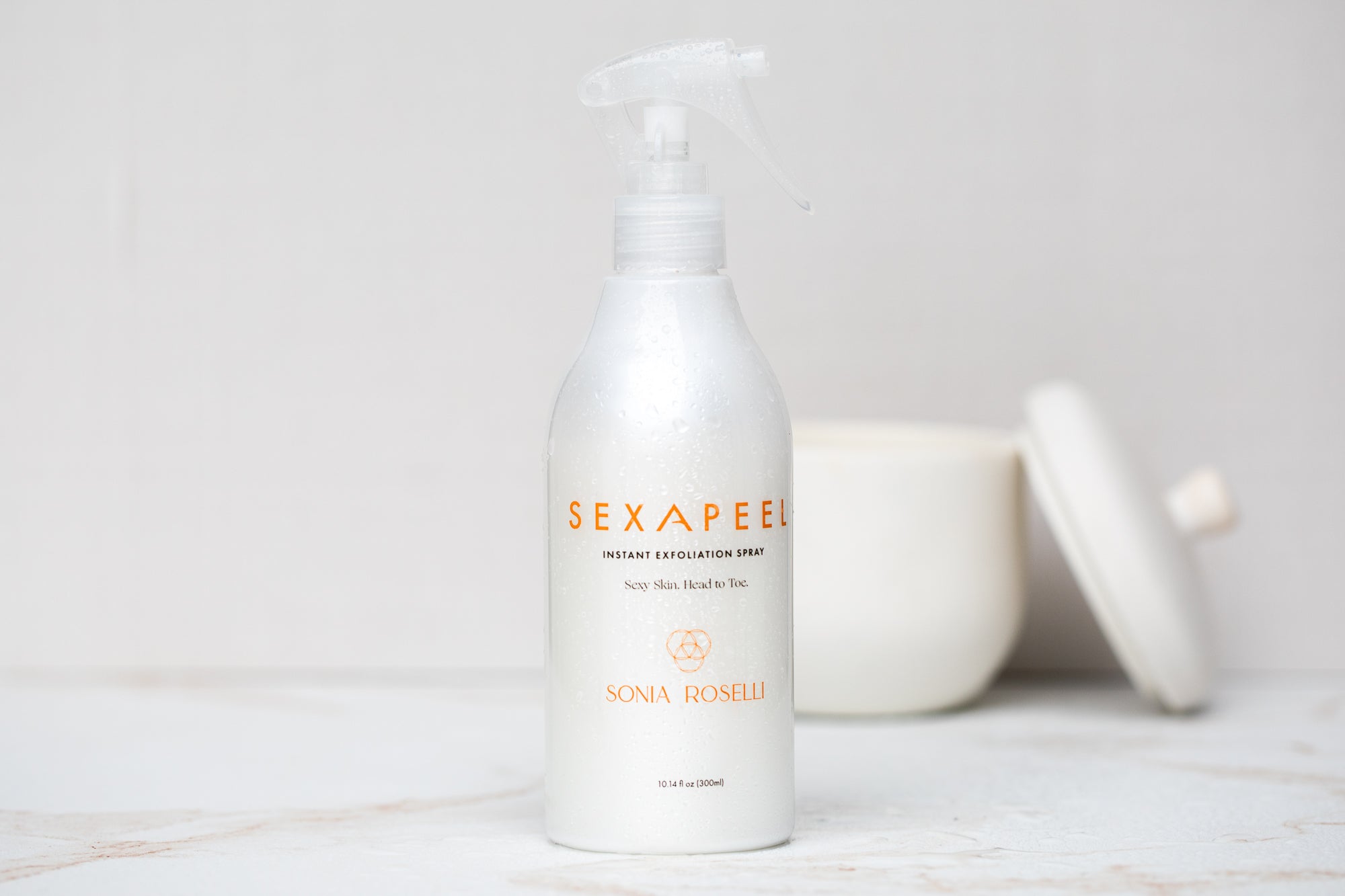 Sexapeel exfoliation spray on marble count in bathroom