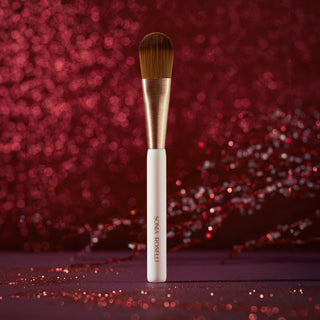 Skin Prep Brush on Red Holiday Background 