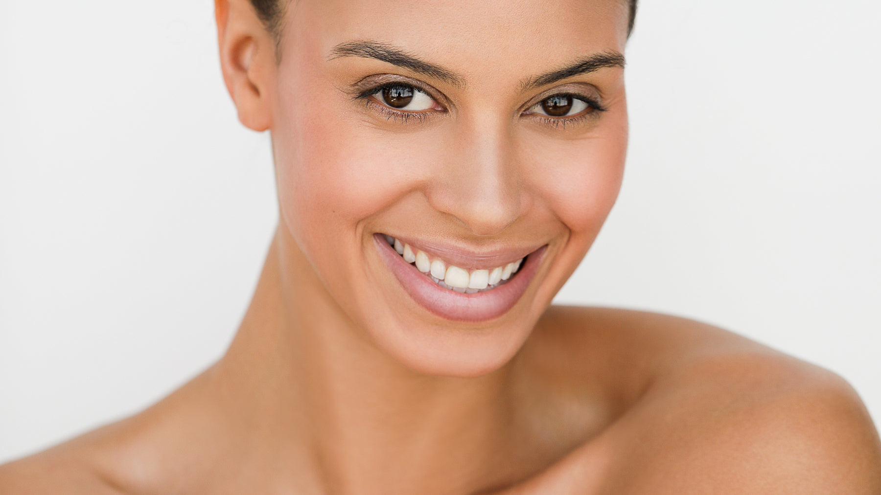 Smiling woman with glowing skin