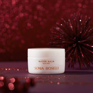 Water Balm on red holiday background 