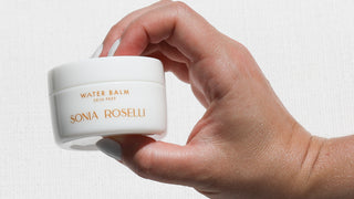 Water Balm held up to camera