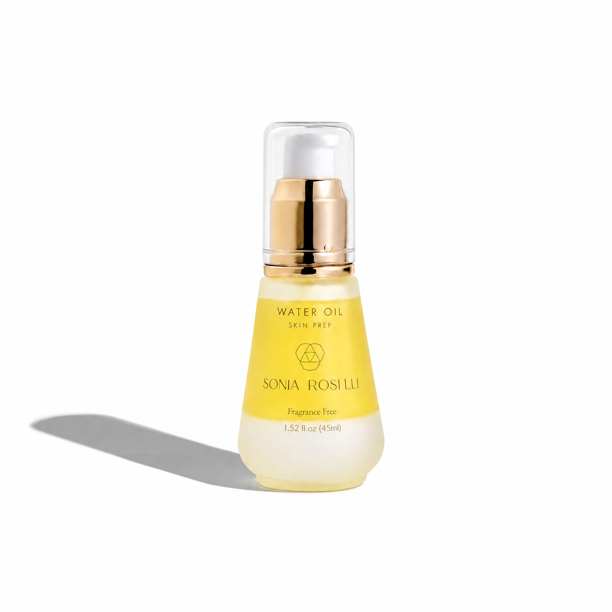 A bottle of Sonia Rosetti Water Oil Skin Prep fragrance-free water oil with a gold pump and clear cap, set against a plain white background with a soft shadow.