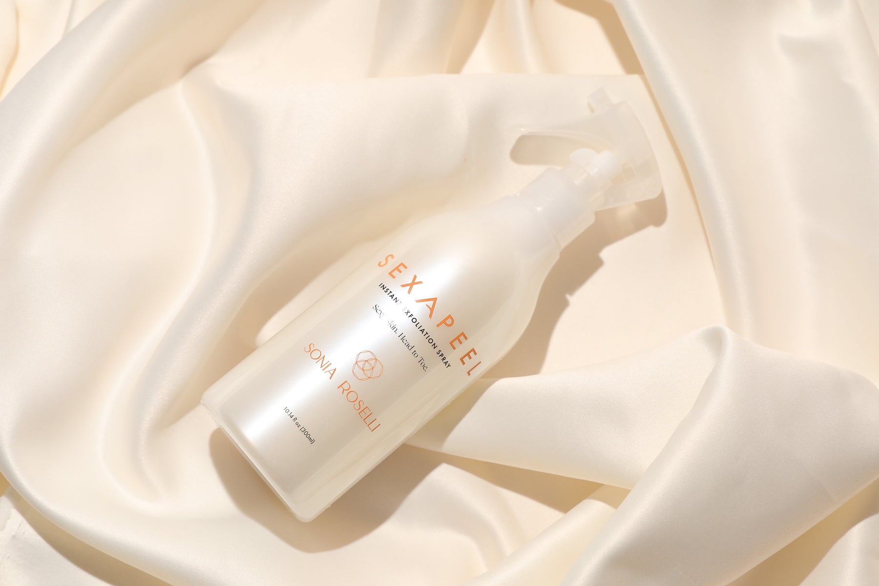 In a striking product presentation, Sonia Roselli Beauty's Sexapeel Exfoliation Spray gleams under focused light, epitomizing its innovative and effective exfoliation properties, offering a radiant transformation for your skin