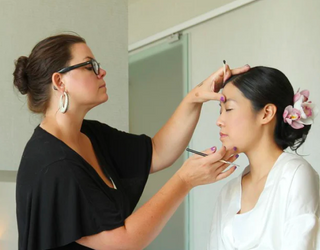 Sonia doing makeup on a client 