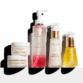 Five Sonia Roselli skincare bottles and jars arranged on a white surface with strong black shadows against a white background. The products include Water Balm, Intense Barrier Cream, Japanese Cleansing Oil, Water Elixir, and a yellow-toned serum or oil, each labeled with the Sonia Roselli brand.