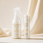 Two white skincare bottles from Sexapeel by Sonia Ronelli, including a spray bottle and a pump bottle, styled on a beige surface with draped cream fabric in the background.