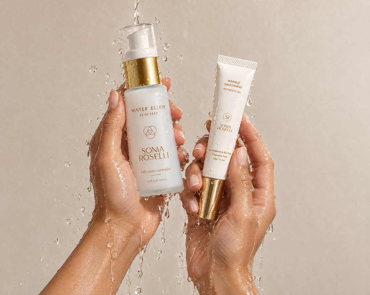 water elixir and eye cream in the hands with water streaming down