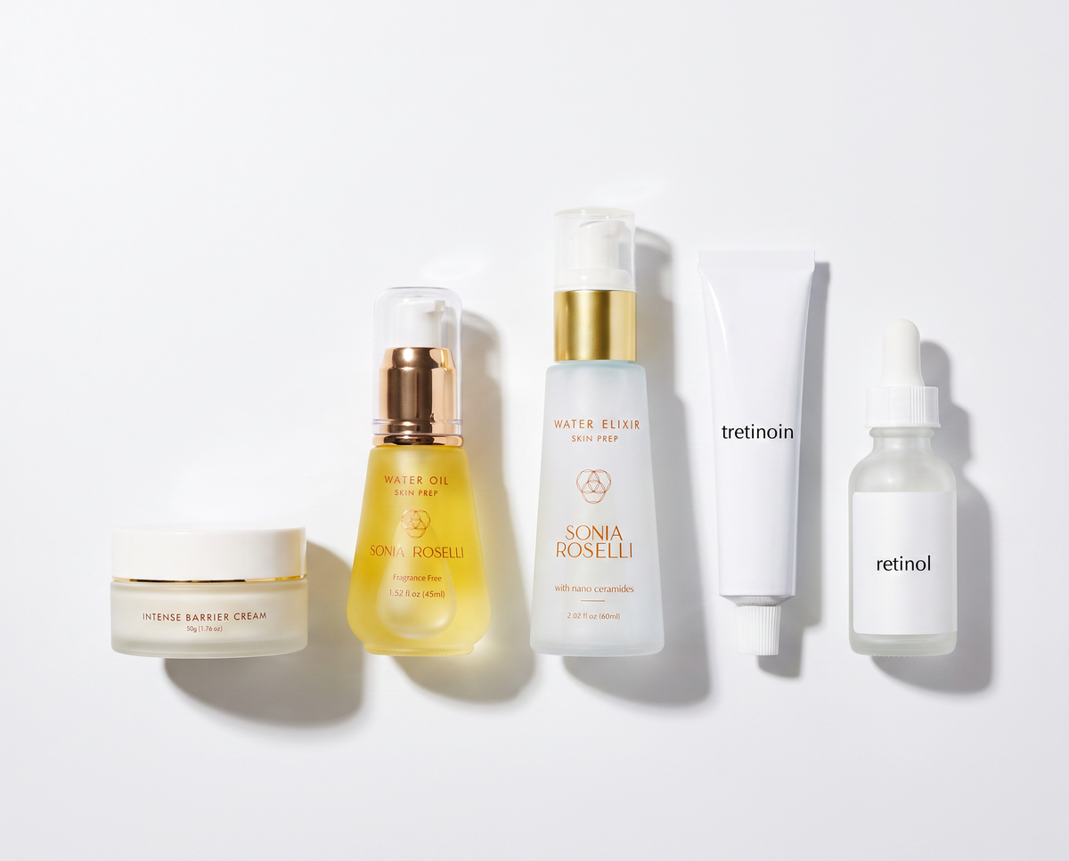 Five skincare products arranged on a clean white background: a white cream jar, a gold-toned serum bottle, a frosted pump bottle labeled Sonia Roselli Water Blur Skin Prep, a white tube labeled tretinoin, and a frosted dropper bottle labeled retinol.