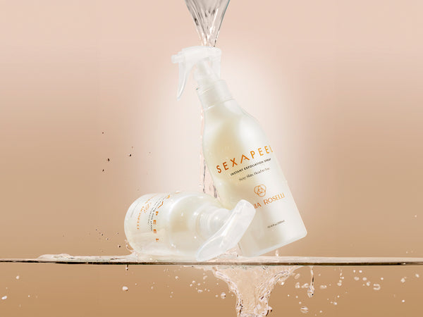 image of sexapeel spray on glass shelf with water beading down for exfoliation for face and body
