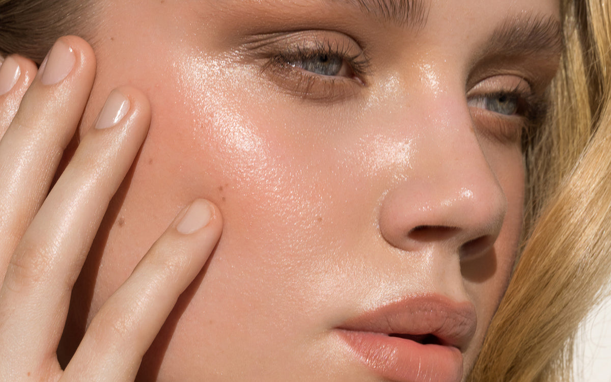Close-up of a person's face with visible skin texture and expression.