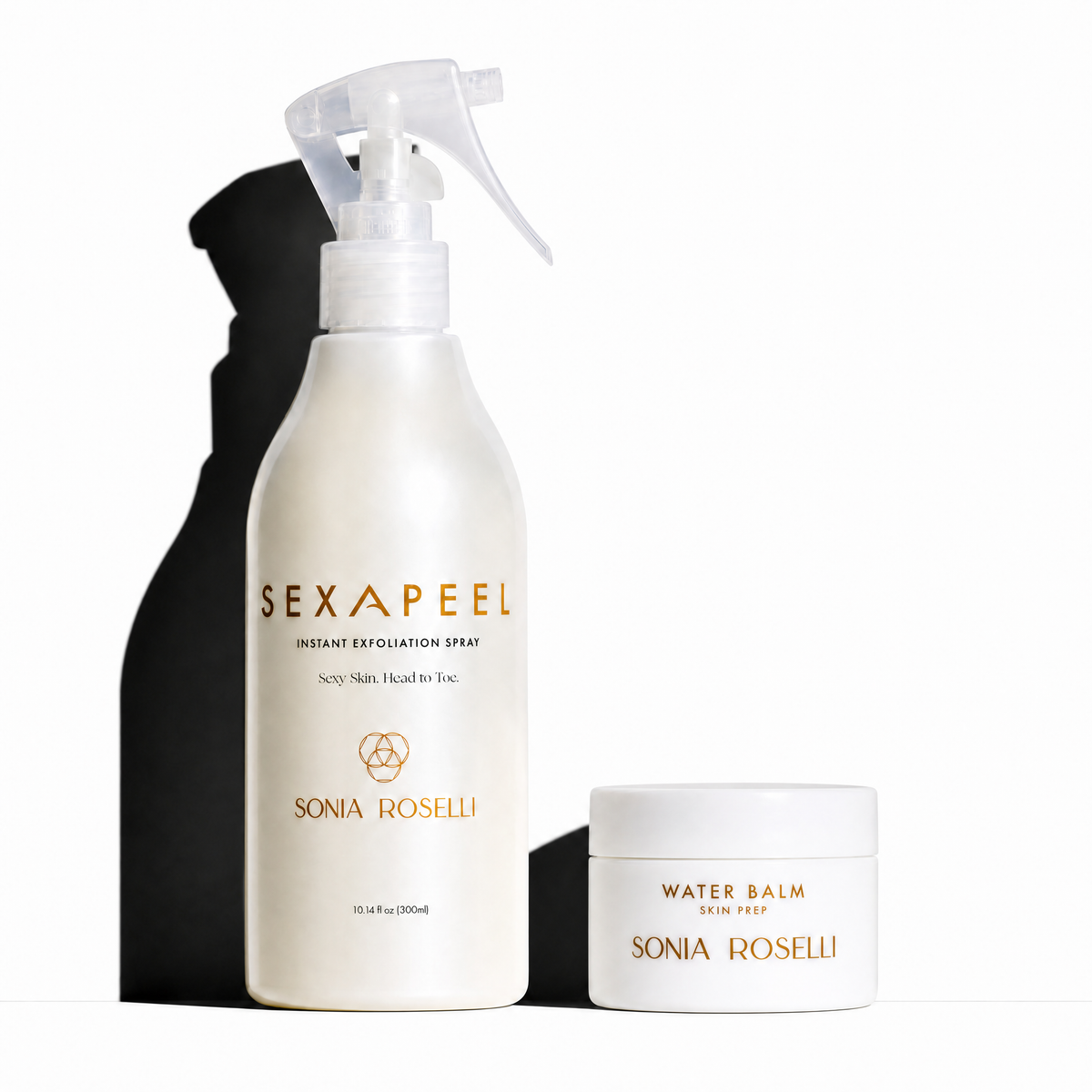 Sonia Roselli Sexapeel Instant Exfoliation Spray bottle in white with gold lettering, shown next to its Water Balm jar on a white background with a prominent black shadow.