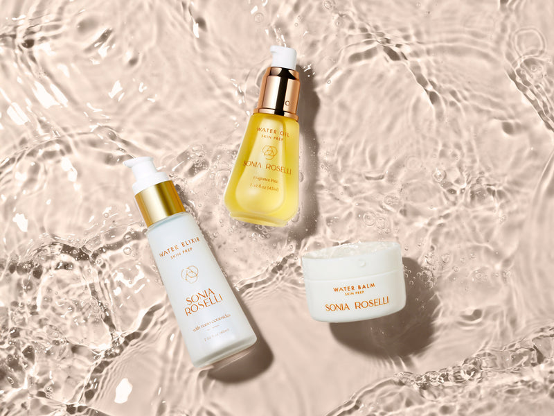 Ageless Beauty Kit with Water Elixir, Water Oil, and Water Balm on rippling water background