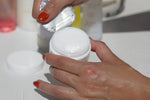Freshly opening the lid of luxurious Water Balm Skin Prep, with Sonia Roselli skincare products in the background