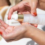Water Elixir being pumped in hands with red fingernails