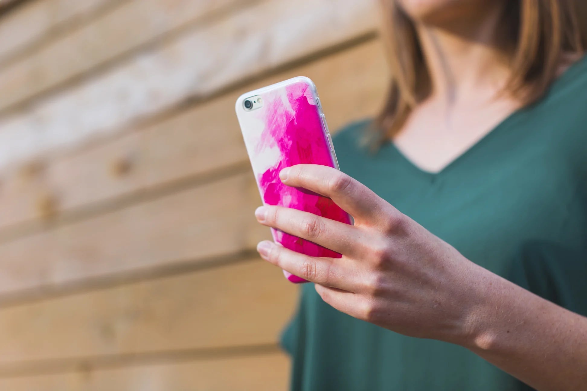 Woman texting on a smartphone.